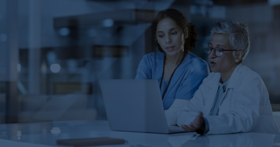 Two scientists looking at the screen using CellarioOS